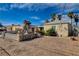 Simple home with a rock garden and a partially fenced front yard at 132 Continental Ave, Henderson, NV 89015