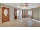 Well-lit living area with tile floors, ample natural light, and a decorative front door at 132 Continental Ave, Henderson, NV 89015