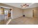 Spacious living room with tile flooring, neutral paint, and a ceiling fan at 132 Continental Ave, Henderson, NV 89015