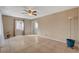 Open living area with tile floors, neutral walls, and a view into the kitchen at 132 Continental Ave, Henderson, NV 89015
