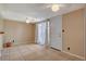 Living room featuring tile floors, white door, and lots of natural light from the windows at 132 Continental Ave, Henderson, NV 89015