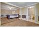 Comfortable bedroom with neutral color walls, carpet, and adjacent bathroom at 132 Continental Ave, Henderson, NV 89015