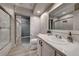 Modern bathroom with white cabinets and marble countertops at 1456 Via Merano St, Henderson, NV 89052