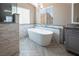 Bathroom with freestanding tub and walk-in shower at 1559 Via Della Scala, Henderson, NV 89052