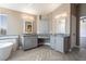 Double vanity bathroom with gray cabinets and herringbone tile floor at 1559 Via Della Scala, Henderson, NV 89052