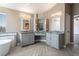 Double vanity bathroom with gray cabinets and herringbone tile floor at 1559 Via Della Scala, Henderson, NV 89052