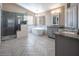 Elegant bathroom with soaking tub, walk-in shower, and gray cabinets at 1559 Via Della Scala, Henderson, NV 89052