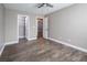 Bedroom with wood-look floors and access to closet and bathroom at 1559 Via Della Scala, Henderson, NV 89052