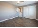 Bedroom with wood-look floors, double doors, and dutch door at 1559 Via Della Scala, Henderson, NV 89052