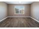 Well-lit bedroom with hardwood floors and large window at 1559 Via Della Scala, Henderson, NV 89052