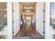 Two-story entry with hardwood floors and open staircase at 1559 Via Della Scala, Henderson, NV 89052