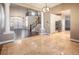 Elegant two-story entryway with hardwood floors, columns, and a view of the kitchen at 1559 Via Della Scala, Henderson, NV 89052