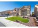 Two-story house with a three-car garage and landscaped lawn at 1559 Via Della Scala, Henderson, NV 89052