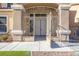 Elegant entryway with ornate iron gate and double doors at 1559 Via Della Scala, Henderson, NV 89052