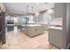 Modern kitchen with an island and stainless steel appliances at 1559 Via Della Scala, Henderson, NV 89052