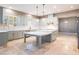 Modern kitchen with an island and stainless steel appliances at 1559 Via Della Scala, Henderson, NV 89052