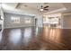 Open living room with hardwood floors, high ceilings, and a fireplace at 1559 Via Della Scala, Henderson, NV 89052