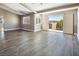 Bright and spacious living room with hardwood floors and access to a balcony at 1559 Via Della Scala, Henderson, NV 89052