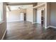 Large living room with hardwood floors, high ceilings, and barn door at 1559 Via Della Scala, Henderson, NV 89052