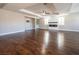 Large living area with hardwood floors, high ceilings, and a modern fireplace at 1559 Via Della Scala, Henderson, NV 89052