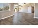 Spacious living room featuring hardwood floors and access to balcony at 1559 Via Della Scala, Henderson, NV 89052