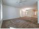 Spacious living room featuring neutral carpeting and a ceiling fan at 1803 Eagle Village Ave, Henderson, NV 89012