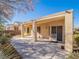 Covered patio with flagstone pathway and desert landscaping at 1803 Eagle Village Ave, Henderson, NV 89012