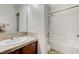 Bathroom with single vanity, tile floor, and shower/tub combo at 1836 La Calera Ave, North Las Vegas, NV 89084