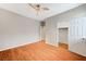 Well lit bedroom with wood floors, ceiling fan and walk-in closet at 1836 La Calera Ave, North Las Vegas, NV 89084