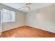 Bright bedroom featuring wood floors and ceiling fan at 1836 La Calera Ave, North Las Vegas, NV 89084
