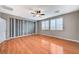 Bright bedroom featuring wood floors and a ceiling fan at 1836 La Calera Ave, North Las Vegas, NV 89084