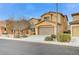 Two-story house with a large garage and landscaping at 1836 La Calera Ave, North Las Vegas, NV 89084