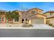 Two-story house with a large garage and landscaping at 1836 La Calera Ave, North Las Vegas, NV 89084