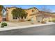 Two-story house with a large garage and landscaping at 1836 La Calera Ave, North Las Vegas, NV 89084
