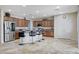 Open concept kitchen with island and stainless steel appliances at 1836 La Calera Ave, North Las Vegas, NV 89084