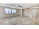 Spacious living room with tile floors and ceiling fan at 1836 La Calera Ave, North Las Vegas, NV 89084