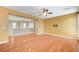 Spacious living room with wood floors and ceiling fan at 1836 La Calera Ave, North Las Vegas, NV 89084