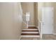 Elegant staircase with wood steps and white railing at 1836 La Calera Ave, North Las Vegas, NV 89084