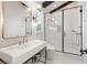 Modern bathroom with white subway tiles, a frameless glass shower, and gold fixtures at 19 Quintessa Cir, Las Vegas, NV 89141