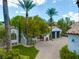 Mediterranean style home with palm trees and gated entry at 19 Quintessa Cir, Las Vegas, NV 89141