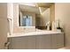 Modern bathroom with floating vanity, large mirror, and elegant fixtures at 20 Lakefront Dr, Henderson, NV 89011