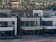 Modern home exterior with multiple levels and balconies at 20 Lakefront Dr, Henderson, NV 89011