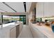 Sleek kitchen with white cabinetry, stainless steel appliances, and a large island at 20 Lakefront Dr, Henderson, NV 89011