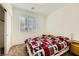 Bright bedroom with a window, carpet, and a patterned bedspread at 20 Barbara Ln # 35, Las Vegas, NV 89183