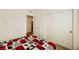 Well-lit bedroom with carpet flooring and sliding door to closet at 20 Barbara Ln # 35, Las Vegas, NV 89183