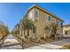 Tan two-story townhome with walkway and landscaping at 20 Barbara Ln # 35, Las Vegas, NV 89183