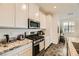 Modern kitchen with granite countertops and stainless steel appliances at 20 Barbara Ln # 35, Las Vegas, NV 89183