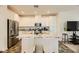 Updated kitchen featuring granite island and white cabinetry at 20 Barbara Ln # 35, Las Vegas, NV 89183
