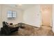 Bright loft with sofa, coffee table, and large window at 20 Barbara Ln # 35, Las Vegas, NV 89183