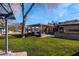 Landscaped backyard with pergola and ample green space at 2800 Ashby Ave, Las Vegas, NV 89102